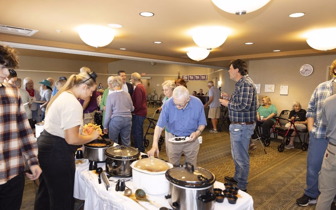 A communal meal brings residents together at Willow Brook Run in Delaware, Ohio, showing the variety of dining experiences and community events that fill the senior living calendar.